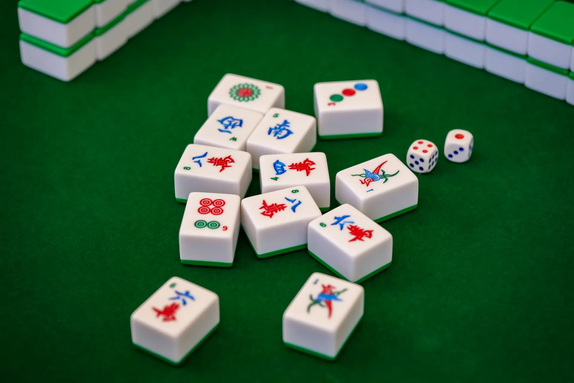 Game pieces and dice resting on a green felt table ready for play